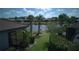 Serene backyard view with lush greenery and a tranquil pond at 1745 Hyssop Loop, North Port, FL 34289