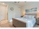 Comfortable bedroom featuring carpet flooring, and a stylish bed with appealing blue and white striped pillows at 1745 Hyssop Loop, North Port, FL 34289