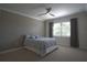 Neutral bedroom featuring a ceiling fan, window with shutters, and natural light at 1745 Hyssop Loop, North Port, FL 34289