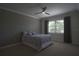 Comfortable bedroom with a ceiling fan and natural light from the window at 1745 Hyssop Loop, North Port, FL 34289