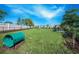 Community dog park with green space, playful equipment, and comfortable benches for a pet-friendly atmosphere at 1745 Hyssop Loop, North Port, FL 34289