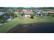 Beautiful lake view home with well-maintained lawn and landscaping at 1745 Hyssop Loop, North Port, FL 34289