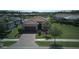 Well-maintained home with a lush lawn and a paved driveway at 1745 Hyssop Loop, North Port, FL 34289