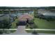 Beautiful single-Gathering home with well-manicured lawn and tropical landscaping and paver driveway at 1745 Hyssop Loop, North Port, FL 34289
