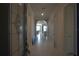 Inviting hallway with tile flooring leading to an open living space at 1745 Hyssop Loop, North Port, FL 34289
