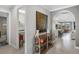 Hallway view with archway to open concept living space, laundry room, and stylish decor at 1745 Hyssop Loop, North Port, FL 34289