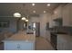 Modern kitchen features a large island, stainless steel appliances, and white cabinetry at 1745 Hyssop Loop, North Port, FL 34289
