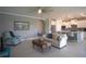 Bright living room with tile flooring, neutral furniture, and an open concept design at 1745 Hyssop Loop, North Port, FL 34289