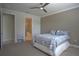 Spacious main bedroom with ceiling fan and ensuite bath at 1745 Hyssop Loop, North Port, FL 34289