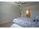 Bedroom with ceiling fan and ensuite bath at 1745 Hyssop Loop, North Port, FL 34289