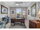 Well-lit office space with a large desk, neutral colors, and elegant decor at 1745 Hyssop Loop, North Port, FL 34289