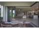 The outdoor patio has comfortable seating and seamless transition to a kitchen and living space at 1745 Hyssop Loop, North Port, FL 34289
