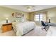 Bright bedroom features a ceiling fan, carpeted floors, window, and a comfortable queen sized bed at 175 Kings Hwy # 1114, Punta Gorda, FL 33983