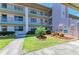 The building's facade showcases mature landscaping and well-maintained grounds at 175 Kings Hwy # 1114, Punta Gorda, FL 33983