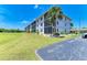 Condo building's exterior with screened balconies at 175 Kings Hwy # 1114, Punta Gorda, FL 33983