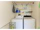 Laundry room with washer, dryer, and shelving for storage at 175 Kings Hwy # 1114, Punta Gorda, FL 33983