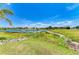 Scenic view of a tranquil pond with condos in the background at 175 Kings Hwy # 1114, Punta Gorda, FL 33983