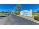 Community sign for Newport Condominiums and St. James Place with manicured landscaping and clear blue skies at 175 Kings Hwy # 1114, Punta Gorda, FL 33983