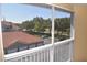 A pleasant balcony view shows a parking area, well-maintained greenery, and the neighborhood buildings at 18001 Richmond Place Dr # 636, Tampa, FL 33647
