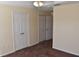 Bedroom with neutral walls, carpet and doors to a walk-in closet at 18001 Richmond Place Dr # 636, Tampa, FL 33647
