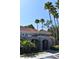 Exterior view of the community clubhouse showcasing palm trees and inviting entrance at 18001 Richmond Place Dr # 636, Tampa, FL 33647