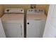 Convenient laundry room with white washer and dryer at 18001 Richmond Place Dr # 636, Tampa, FL 33647