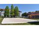 Volleyball court and playground with condo buildings and blue sky in the background at 18001 Richmond Place Dr # 636, Tampa, FL 33647