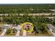 Overhead view of the property highlighting the pool, solar panels, and surrounding greenery at 21080 Firwood Ter, Port Charlotte, FL 33954