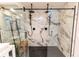 Modern bathroom featuring a marble shower with dual shower heads at 21080 Firwood Ter, Port Charlotte, FL 33954