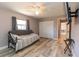Bright bedroom with wood floor, ceiling fan, large closet and convertible daybed at 21080 Firwood Ter, Port Charlotte, FL 33954