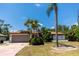 Beautiful single Gathering home with desert landscaping, solar panels and two car garage at 21080 Firwood Ter, Port Charlotte, FL 33954