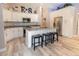 Bright modern kitchen with stainless steel appliances, island with seating, and white cabinetry at 21080 Firwood Ter, Port Charlotte, FL 33954
