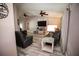 Open-concept living room with modern decor, ceiling fans and wood-look flooring at 21080 Firwood Ter, Port Charlotte, FL 33954