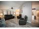 Living room showcasing open floor plan connecting kitchen with seating, and natural lighting at 21080 Firwood Ter, Port Charlotte, FL 33954