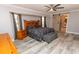 Comfortable main bedroom featuring a wooden bed frame and a sliding barn door at 21080 Firwood Ter, Port Charlotte, FL 33954