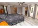Spacious main bedroom with barn door leading to ensuite bathroom and private patio access at 21080 Firwood Ter, Port Charlotte, FL 33954