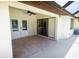 Covered lanai with tile flooring leading to a pool and a large backyard at 21080 Firwood Ter, Port Charlotte, FL 33954