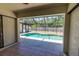 Patio view of a screened-in pool, offering a relaxing outdoor space at 21080 Firwood Ter, Port Charlotte, FL 33954