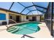 Beautiful screened pool with in-ground spa and a spacious deck, great for entertaining at 21080 Firwood Ter, Port Charlotte, FL 33954