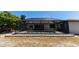 Backyard view showcasing the screened-in pool and a well-maintained outdoor space at 21080 Firwood Ter, Port Charlotte, FL 33954