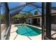 Inviting screened pool area featuring a clear pool and an airy, sunlit enclosure at 21080 Firwood Ter, Port Charlotte, FL 33954