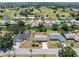 Aerial shot of homes in a neighborhood near a golf course, highlighting community amenities and green spaces at 218 Parkview Dr, Venice, FL 34293