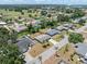Suburban neighborhood aerial view features well-maintained homes, lush greenery, and a golf course nearby at 218 Parkview Dr, Venice, FL 34293