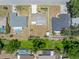 An aerial view of a home with a big backyard, in a quiet neighborhood with mature trees at 218 Parkview Dr, Venice, FL 34293