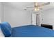 Bedroom with a blue bed, fan, and neutral gray wall color at 218 Parkview Dr, Venice, FL 34293