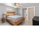 Neutral bedroom with gray walls, wood-look floors, and a decorative sliding barn door at 218 Parkview Dr, Venice, FL 34293