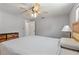 Spacious bedroom with gray walls, a modern ceiling fan, and bi-fold closet doors at 218 Parkview Dr, Venice, FL 34293