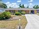 Charming single-story home featuring a well-manicured lawn and a concrete driveway at 218 Parkview Dr, Venice, FL 34293