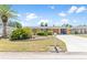Charming single-story home with a well-manicured lawn and landscaping at 218 Parkview Dr, Venice, FL 34293