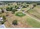 Beautiful aerial of a golf course in a suburban area at 218 Parkview Dr, Venice, FL 34293